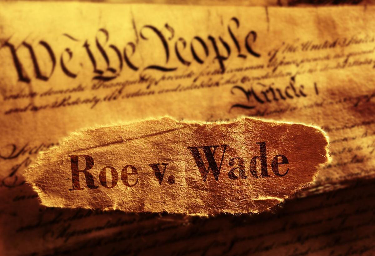 parchment pieces with phrases "We the People" and "Roe v. Wade"